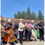 Oregon Governor Tina Kotek holds scissors with Klamath Tribal Chairman William Ray Jr. prior to Melita’s Ribbon-Cutting Ceremony.